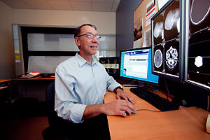 Physician reviewing and analyzing x-rays.